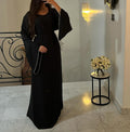 The long-sleeved dress with cuffs and chains